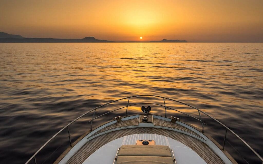 Beneteau 45 boat sunset. Boats in Paros. Charter a Boat.